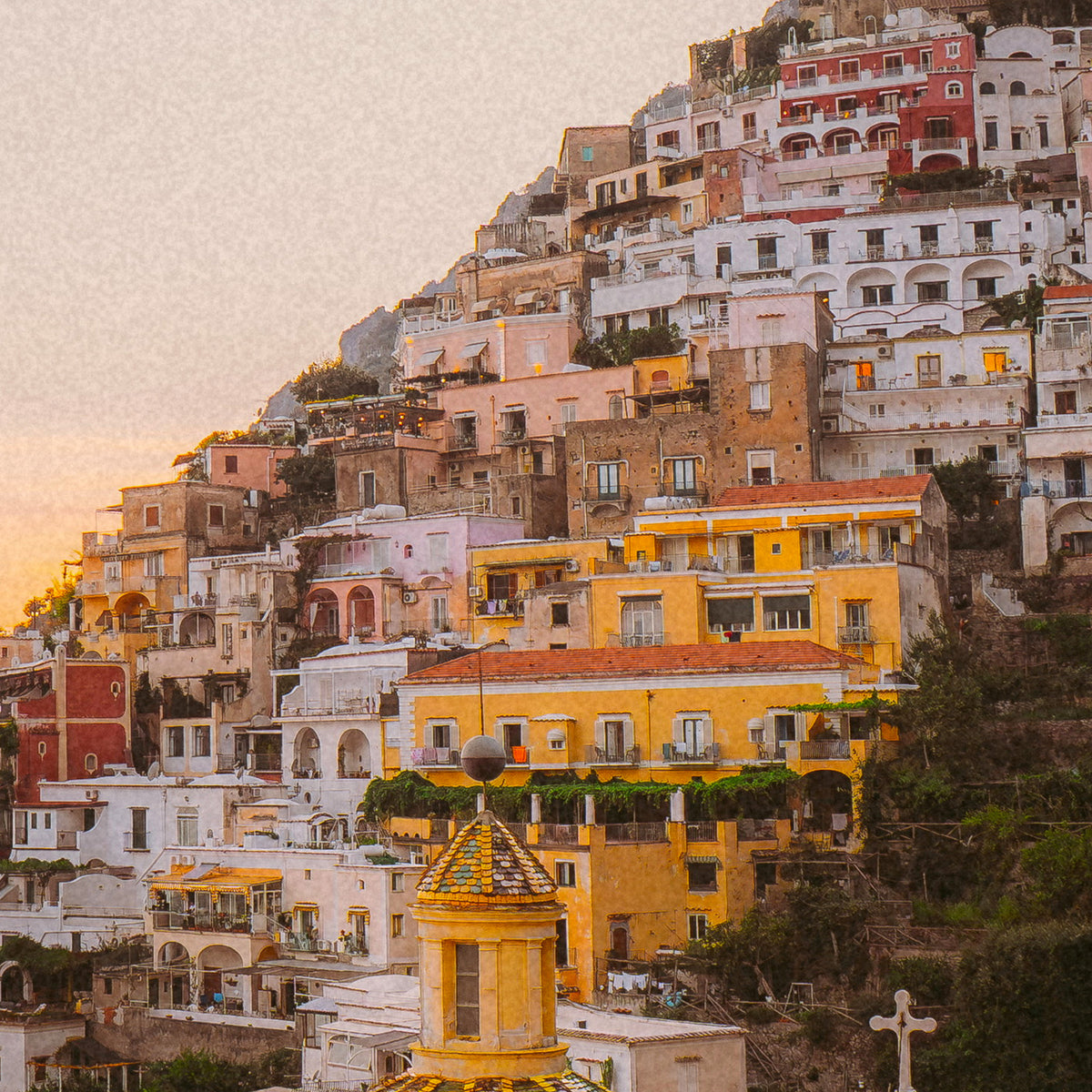 Close-up of Positano hillside with colorful buildings during sunset