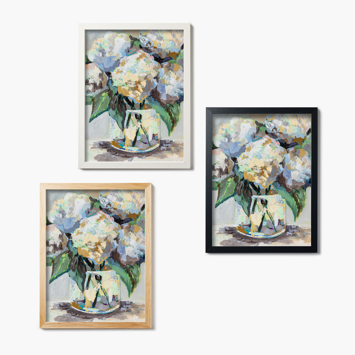 Three framed glass prints of a painting of hydrangea bouquets on a white background