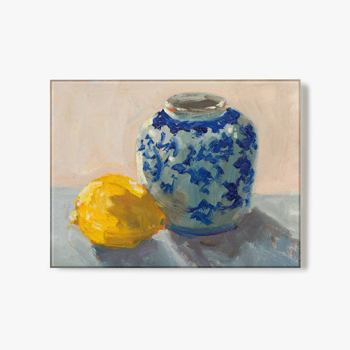 Glass Print of artwork of a blue and white vase with a lemon on a neutral background.