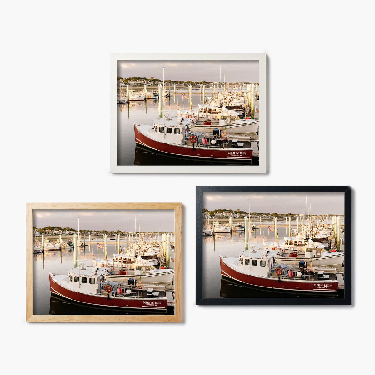 Three framed glass prints of a boat docked at a marina on a white background