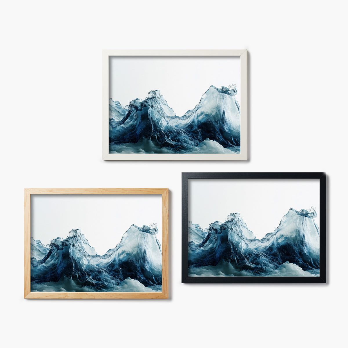 Three framed glass prints of artworks of wavy blue water designs on a white background