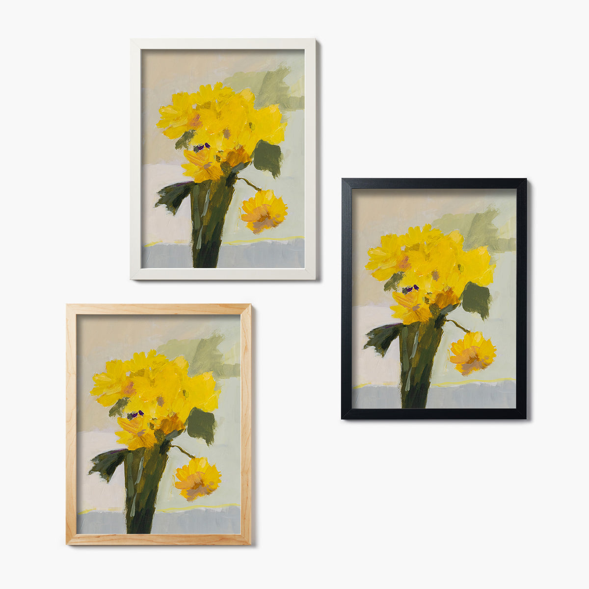 Three framed glass prints of a painting of yellow flowers on a white background